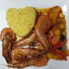 A picture of Mild Red Curry with Prawns and Mango.