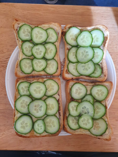 A picture of Cheese on Toast with Cucumber.