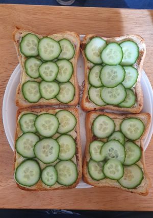 A picture of Cheese on Toast with Cucumber.