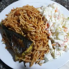 Spagetti with salad and fried fish A picture of Spagetti with salad and fried fish.