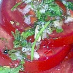 A picture of Sig's Tomato Salad with green Dressing,.