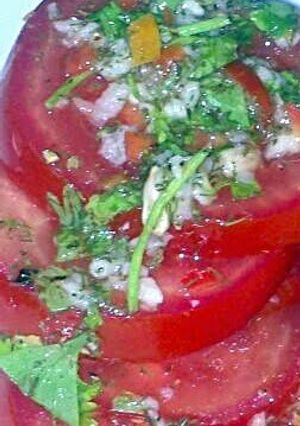 A picture of Sig's Tomato Salad with green Dressing,.