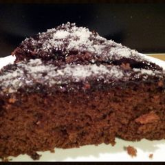 A picture of AMIEs CHOCOLATE Coconut Cake.