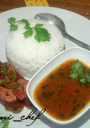 A picture of White rice with sausage soup.