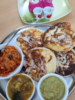 A picture of Onion Uttapam, Sambar, Chutney,.
