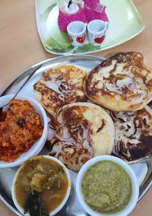 A picture of Onion Uttapam, Sambar, Chutney,.