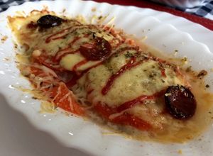 Una foto de Merluza tipo pizza 🐟🍕