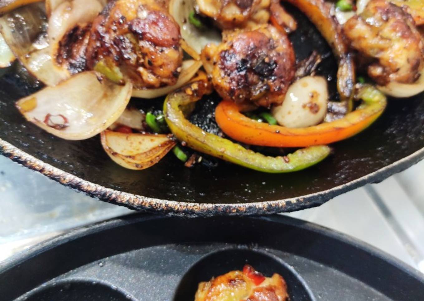 Crispy dry chilli chicken in appe pan