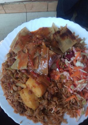 A picture of Pilau with chapo and beef.
