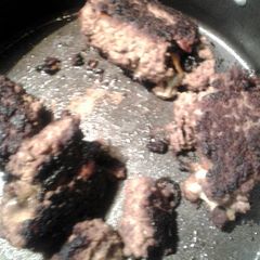 A picture of stovetop stuffed meatloaf and gravy.