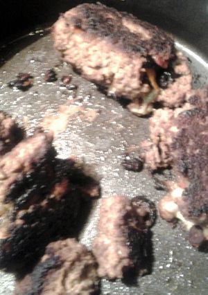 A picture of stovetop stuffed meatloaf and gravy.