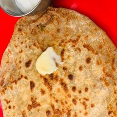A picture of Punjabi Aloo Parantha with anardana(dhaba style).