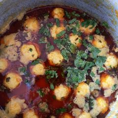 A picture of Chicken kabab with gravy.
