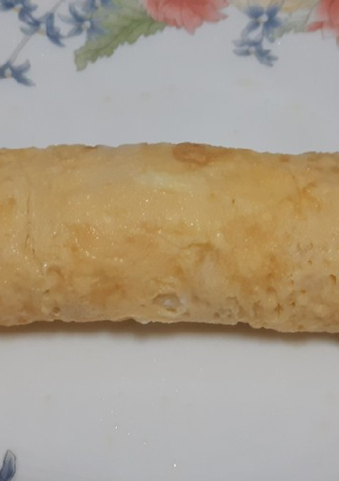 Una foto de Rollo de tortilla con jamón y queso