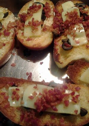 A picture of fried bread with toppings.
