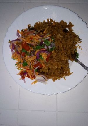 A picture of Beef pilau and kachumbari.