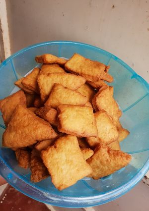 A picture of Crunchy soft Mandazi with cinammon and orange rind.