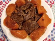 A picture of stew beef with tomato sauce