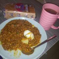 A picture of Porrage beans and egg with bread.