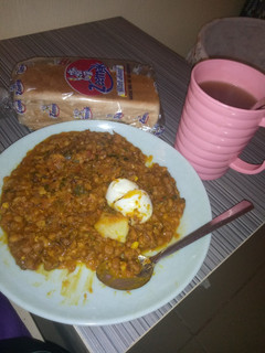 A picture of Porrage beans and egg with bread.