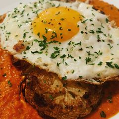 A picture of Vegetarian Friendly: Cauliflower Steak with Romesco Sauce.