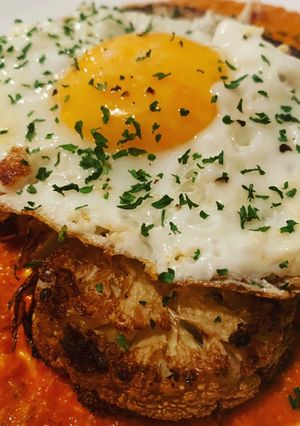 A picture of Vegetarian Friendly: Cauliflower Steak with Romesco Sauce.