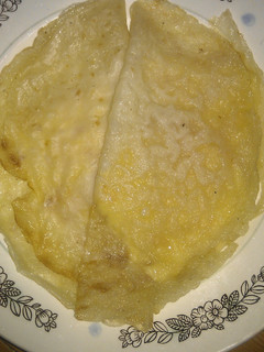 Una foto de Crepes con queso y cebolla