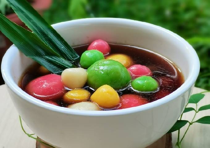 Steaming cup of Wedang Ronde, traditional Indonesian ginger drink for winter