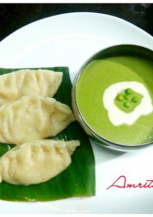 A picture of Cheesy momos with pea soup.