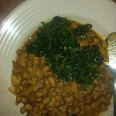Joloff beans with green leaf stew A picture of Joloff beans with green leaf stew.