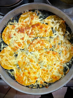 Una foto de Calabaza con espinaca y queso 🧀