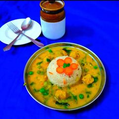Yellow daal tadka with Soya chunks green peas A picture of Yellow daal tadka with Soya chunks green peas.
