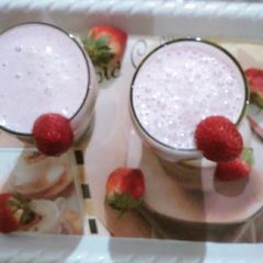 A picture of Strawberry milkshake with vanilla ice cream.