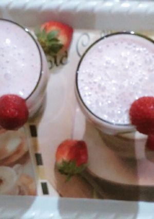 A picture of Strawberry milkshake with vanilla ice cream.