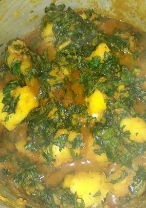 A picture of Porriage yam with vegetable(ugu).