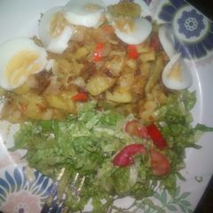 A picture of Stir fry potatoes and lettuce.
