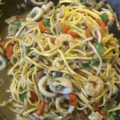 A picture of Thai style seafood with noodles.