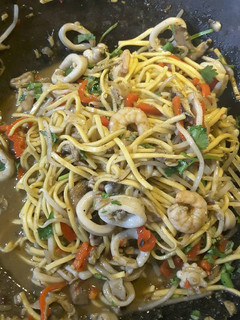 A picture of Thai style seafood with noodles.