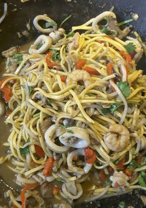 A picture of Thai style seafood with noodles.