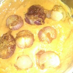 A picture of Stuffed onion with gravy--.