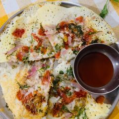 A picture of Tomato Onion Dill Utthapam.
