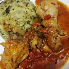 A picture of Mashed potatoes with chicken curry.