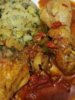 A picture of Mashed potatoes with chicken curry.