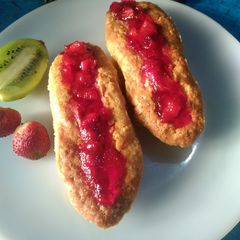A picture of Hotdog shaped cake with strawberry jello.