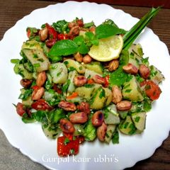 A picture of Red ruby tomato & Emerald green pepper, potato salad with Tulsi sparkle.