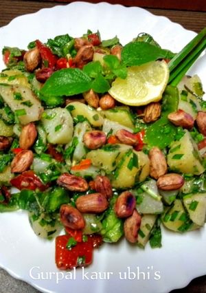 A picture of Red ruby tomato & Emerald green pepper, potato salad with Tulsi sparkle.