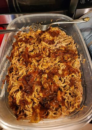 A picture of SPICY Pulled Pork 😋 in Dutch oven.