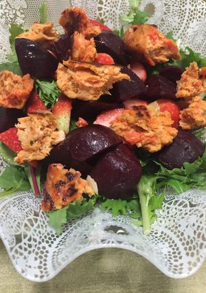 A picture of Baby beetroot & strawberry salad with salmon & mushroom patty.