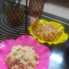 A picture of Chicken manchurian and egg fried rice.