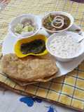 Bhaturas with white chana and boondis raita